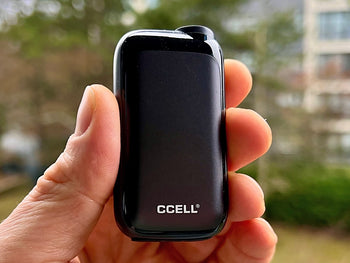 CCell Rizo in black color held in hand