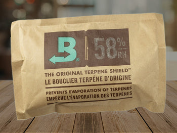 boveda humidity packs size 67 58% on desk background