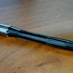 Ceramo XL vaporizer in black zirconia, disassembled to show stem, cap, and chamber components.