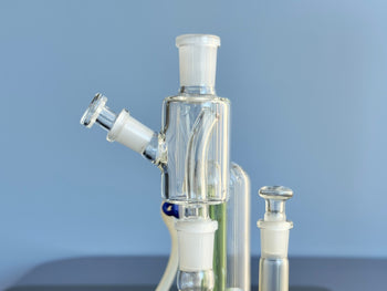dry herb catcher pass-through adapter combination from sneaky Pete vaporizers with 10mm stopper inserted in a water pipe