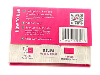 Pink Slip dissolving in water – A Pink Slip cleaning sheet dissolving in hot water inside a glass piece, showing its effective plant-based cleaning action.