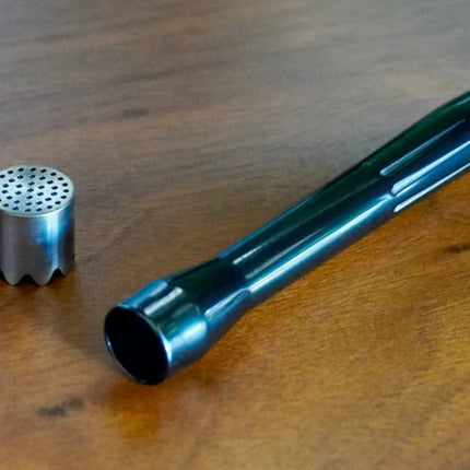 Ceramo XL vaporizer in black zirconia, disassembled to show stem, cap, and chamber components.