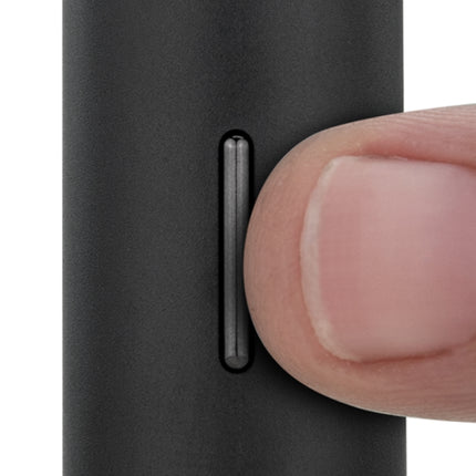 puffco pivot in onyx colour with finger on button