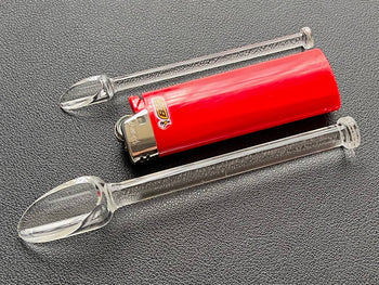 both glass scoops next to standard bic lighter