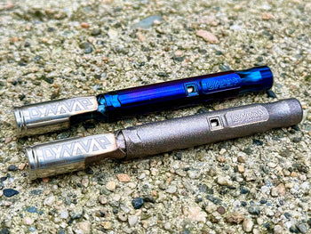 dynavap titanium M in nebulum and Quantium on concrete bench