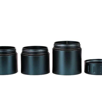 Detailed view of the black Mad Heaters Reload 3 highlighting the threaded lids, decapper mechanism, and CNC-machined finish.