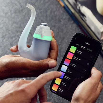Side angle of the New Puffco Proxy in Haze, highlighting its ergonomic design and airflow path.