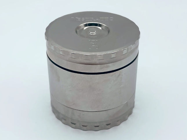 Vestratto Stash closed view — heavy-duty stainless steel debowler and herb container with magnetic lid.