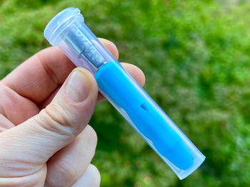 Neon blue Dynavap B Portable Vaporizer in a clear plastic case.