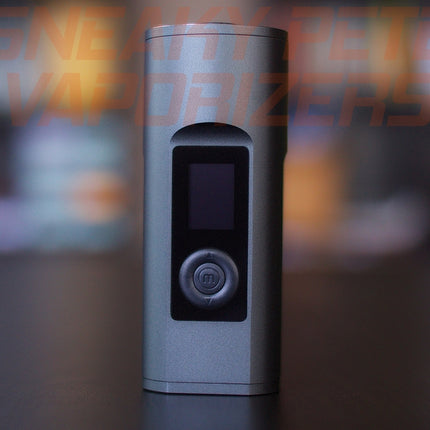 Black Arizer Solo 2 portable dry herb vaporizer standing on a table.  