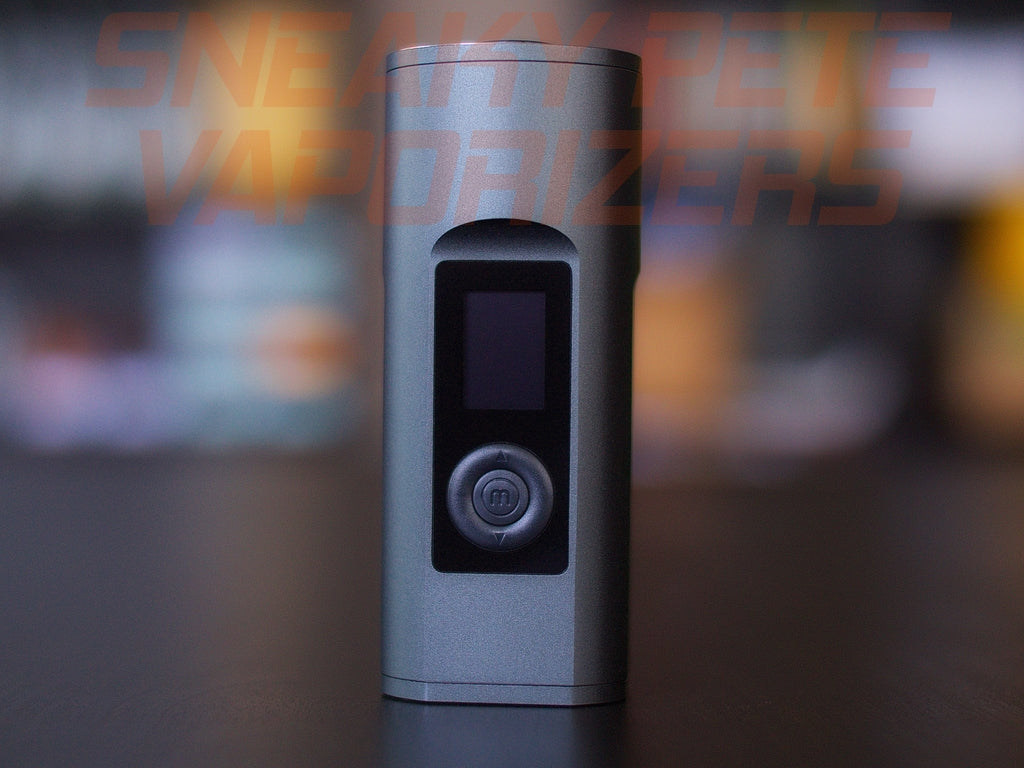 Black Arizer Solo 2 portable dry herb vaporizer standing on a table.  