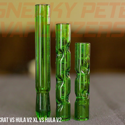 Forest Colored Aristocrat Stems For DynaVap standing on a table next to Forest Hula stem XL and Forest Hula stem.