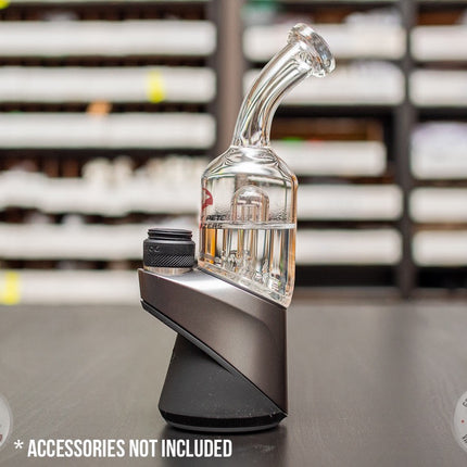 Bent-Neck Peak Pro Top glass piece in Puffco Peak Pro  standing on a black table.