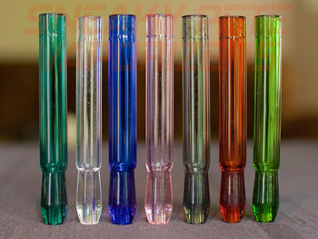 Colored Aristocrat Stems For DynaVap standing on a table.
