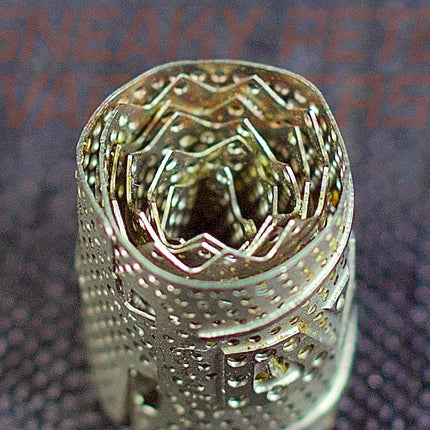 DynaVap DynaCoil on a table.
