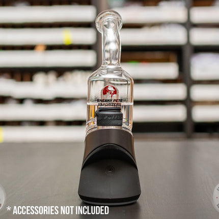 Bent-Neck Peak Pro Top glass piece in Puffco Peak Pro standing on a black table, shown from side view.