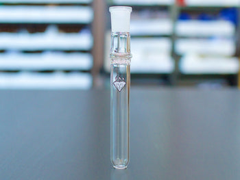 Ditanium Glass Handpiece standing on a table.