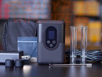 Arizer Go (ArGo) dry herb vaporizer with accessories standing on a table.