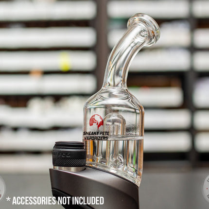 Closeup of a Bent-Neck Peak Pro Top glass piece in Puffco Peak Pro  standing on a black table.