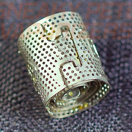 DynaVap DynaCoil on a table sideways.