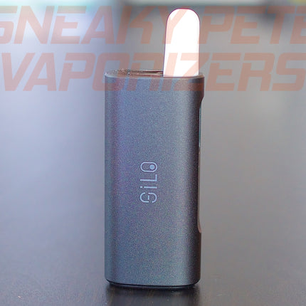 Black Ccell Silo with cartridge inserted standing on a table.