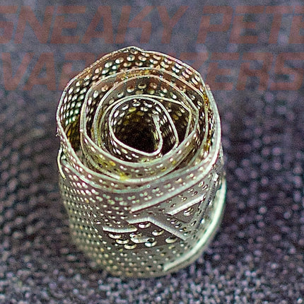 DynaVap DynaCoil on a table.