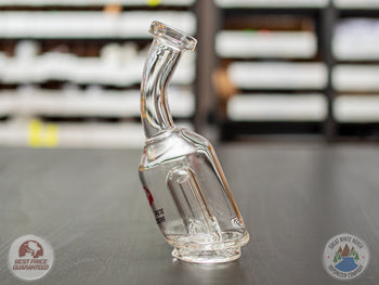 Bent-Neck Peak Pro Top glass piece standing on a black table.