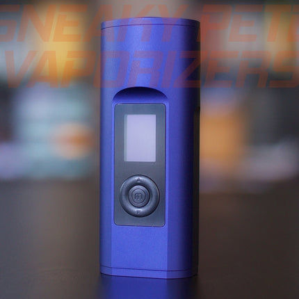 Blue Arizer Solo 2 portable dry herb vaporizer standing on a table. 