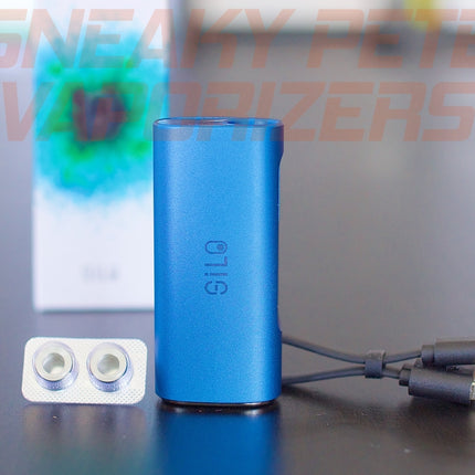 Blue Ccell Silo, with packaging in the background, standing on a table.