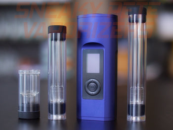 Blue Arizer Solo 2 portable dry herb vaporizer with accessories standing on a table.  