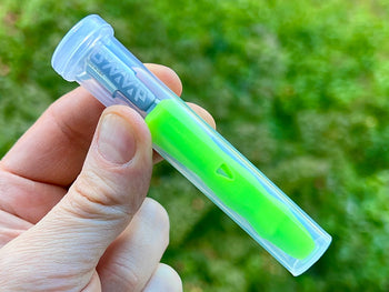 Neon green Dynavap B Portable Vaporizer in a clear plastic case.