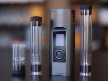 Black Arizer Solo 2 portable dry herb vaporizer with accessories standing on a table.  