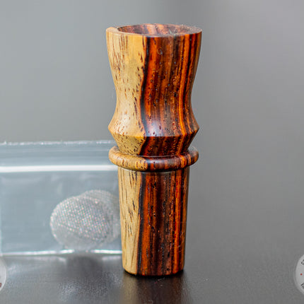 Ed's TNT Injector Bowl standing on a table with screens beside it.