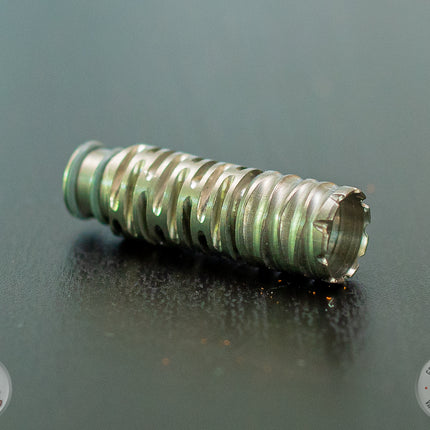 DynaVap Omni 2021 Titanium Tip on a table.