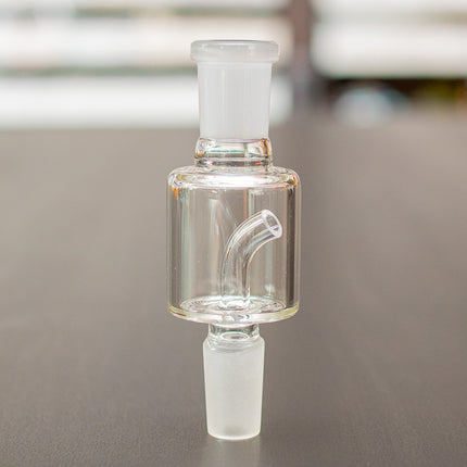 Glass Dry Herb Catcher on a table.