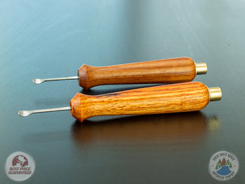 2 Ed's TNT Pack & Stir Tools on a table.