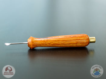 Ed's TNT Pack & Stir Tool on a table.