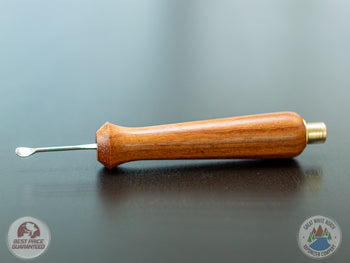 Ed's TNT Pack & Stir Tool on a table.