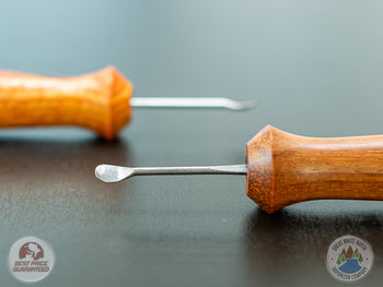 2 Ed's TNT Pack & Stir Tools on a table.