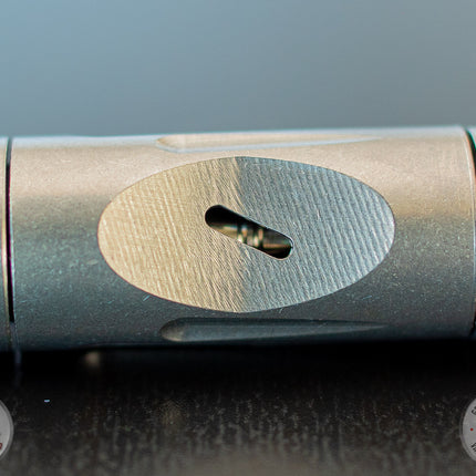 Air port of a DynaVap VonG (i) Portable Vaporizer on a table.